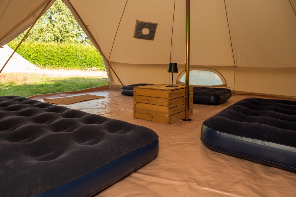 Bell tent with one double and two single airbeds