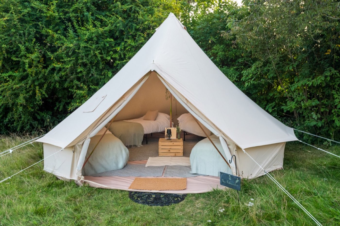 Luxury bell tent with real beds made up for guests